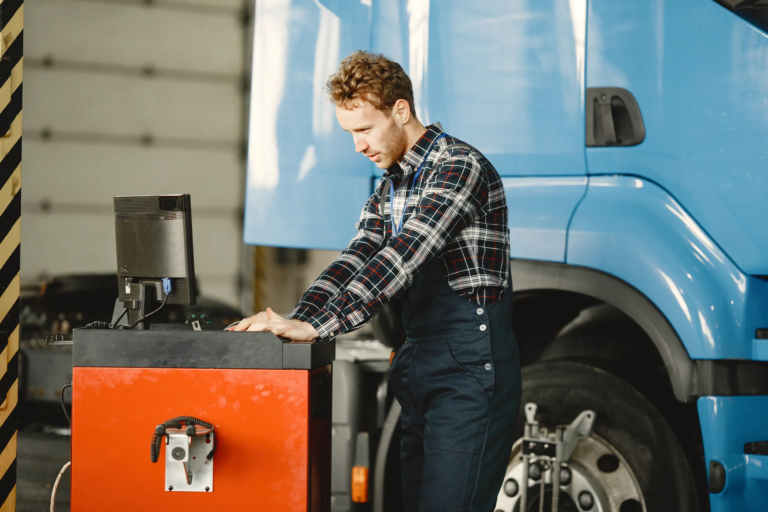 driver-checks-goods-man-uniform-truck-garage.jpg